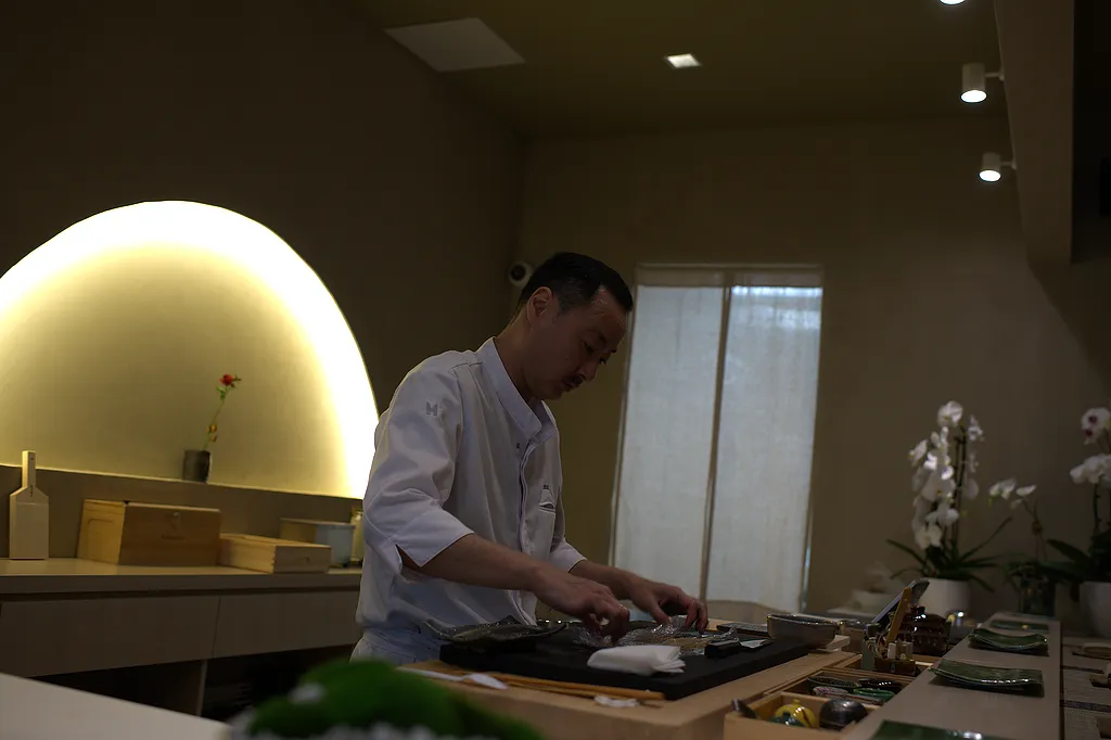 The chef at the counter during the omakase