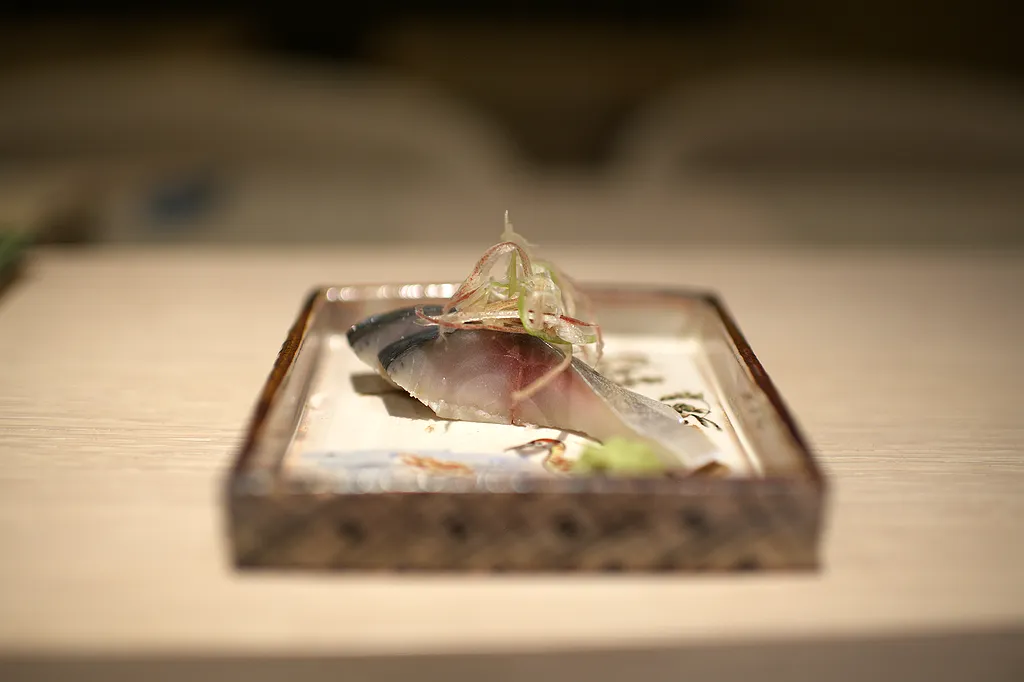 A finished dish seen from the side, steam still rising