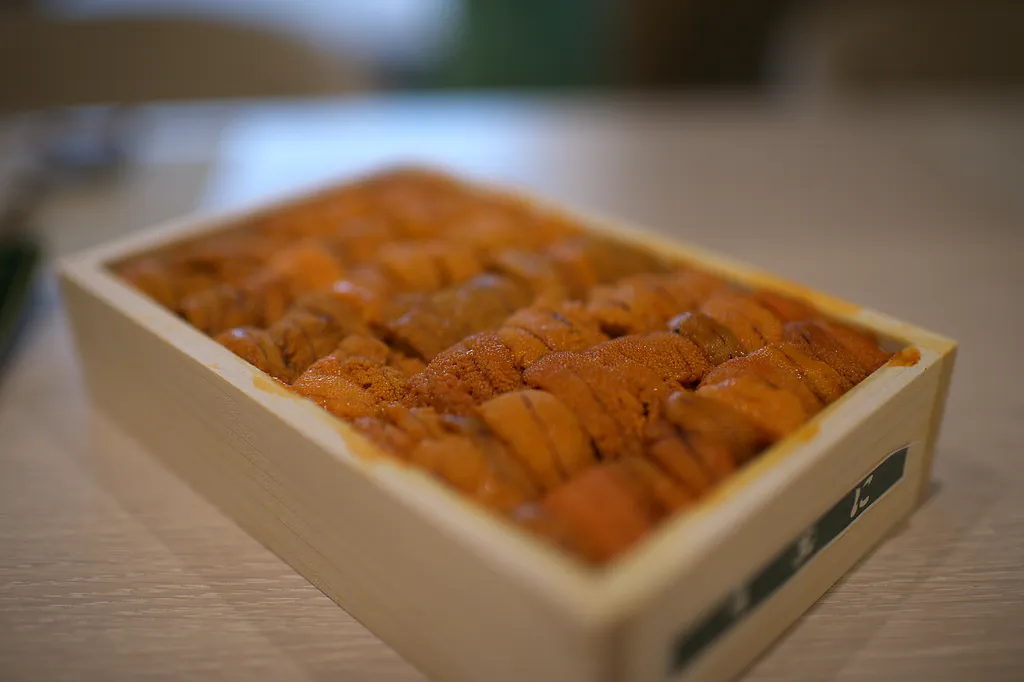 A wooden box of Hokkaido uni, the tongues packed in rows