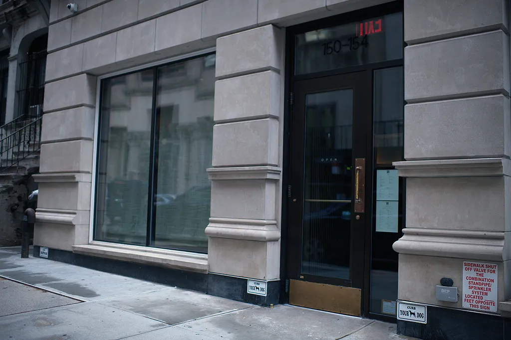 The entrance door and window on the street