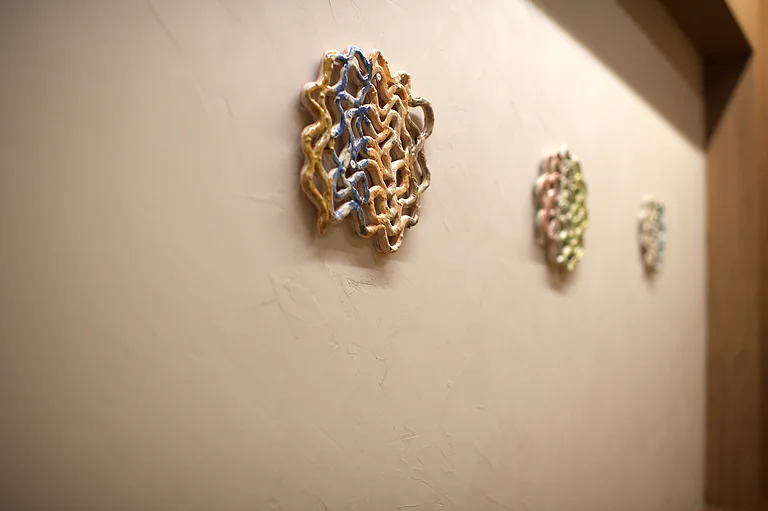 A ceramic wall work in close detail
