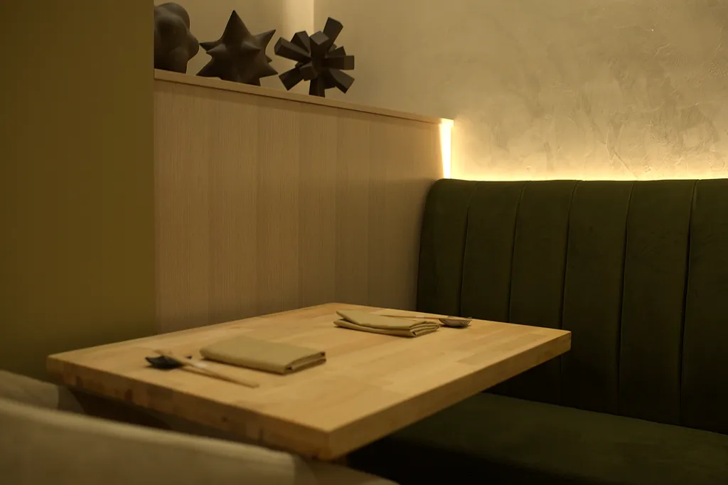 A hinoki table laid with linen and chopsticks